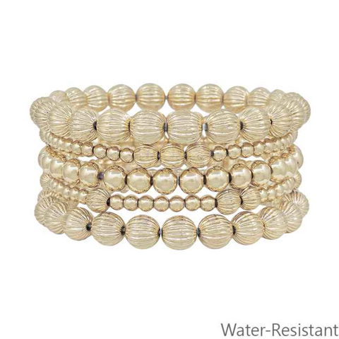 set of 5 variated gold beaded bracelets