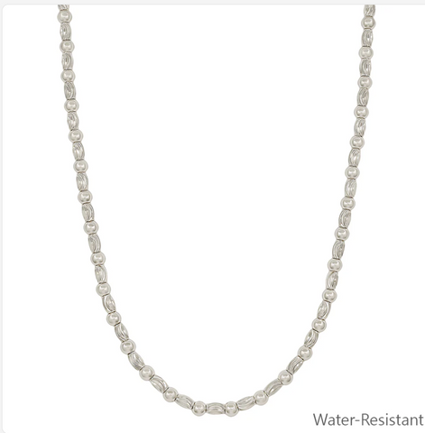 water resistant silver textured oval and gold necklace